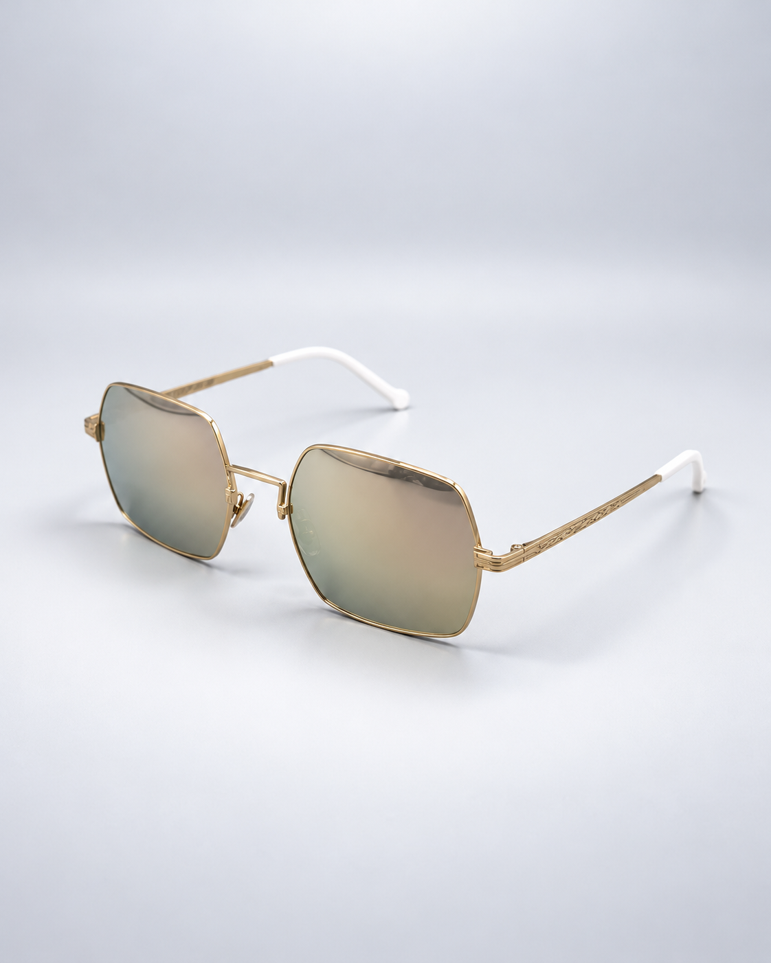 Sunglasses photographed on a pale gray studio background