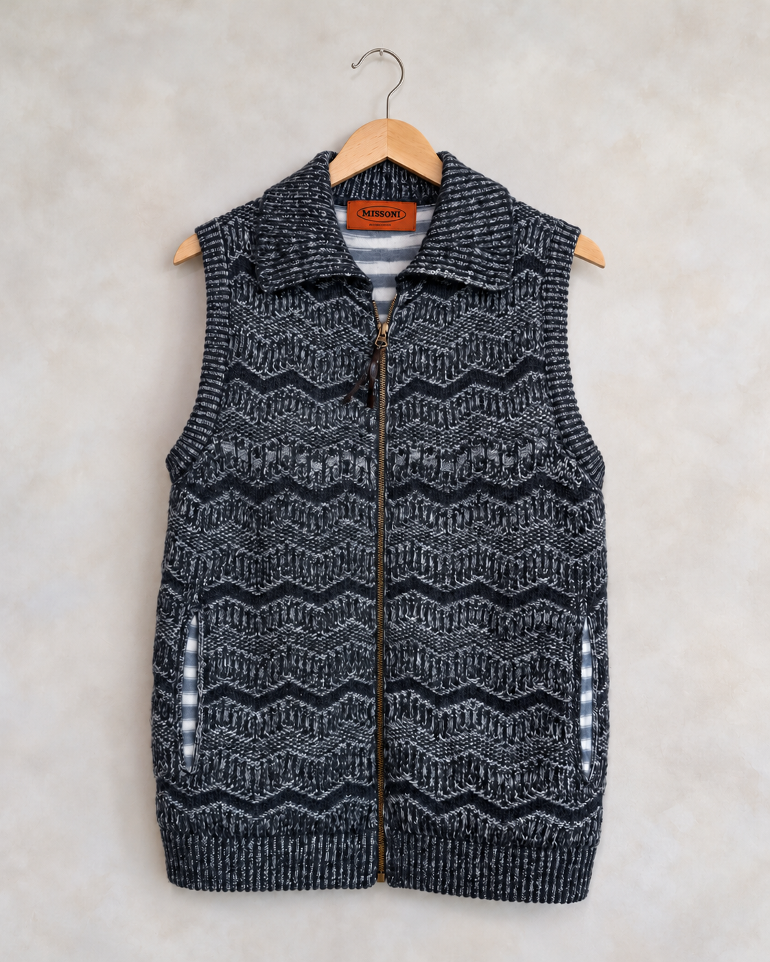 Missoni navy and gray collared zip knit vest on a wooden hanger
