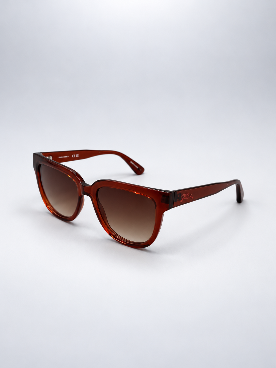 Sunglasses photographed against a soft light gray studio background
