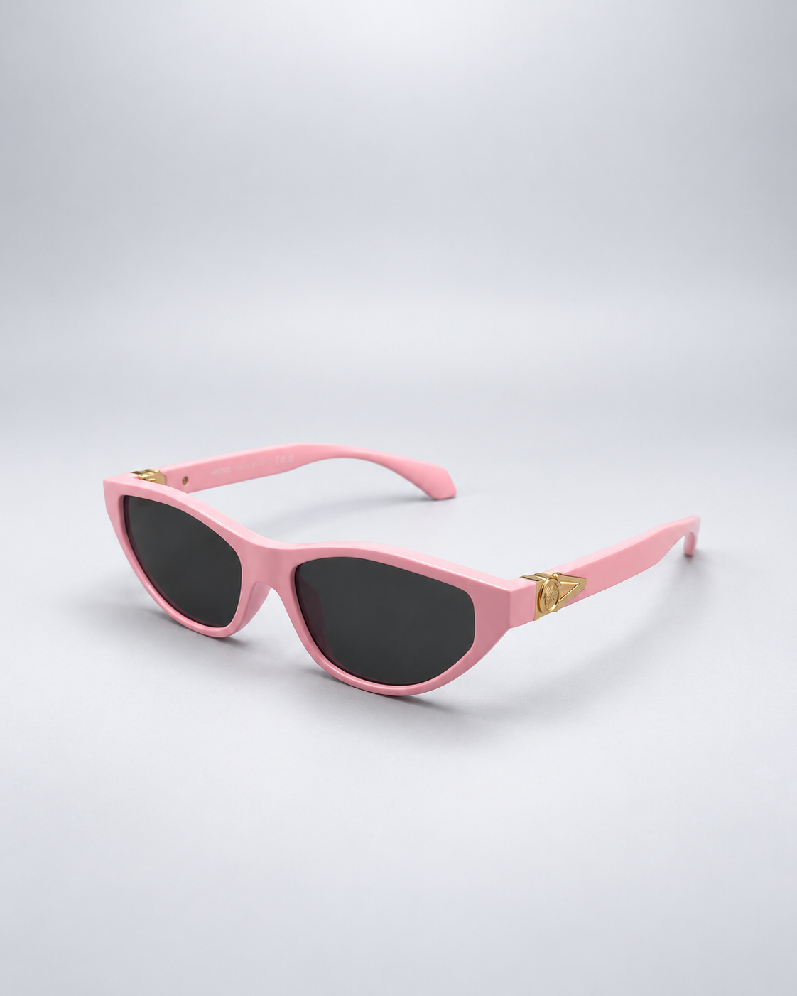 Sunglasses photographed against a soft light gray studio background