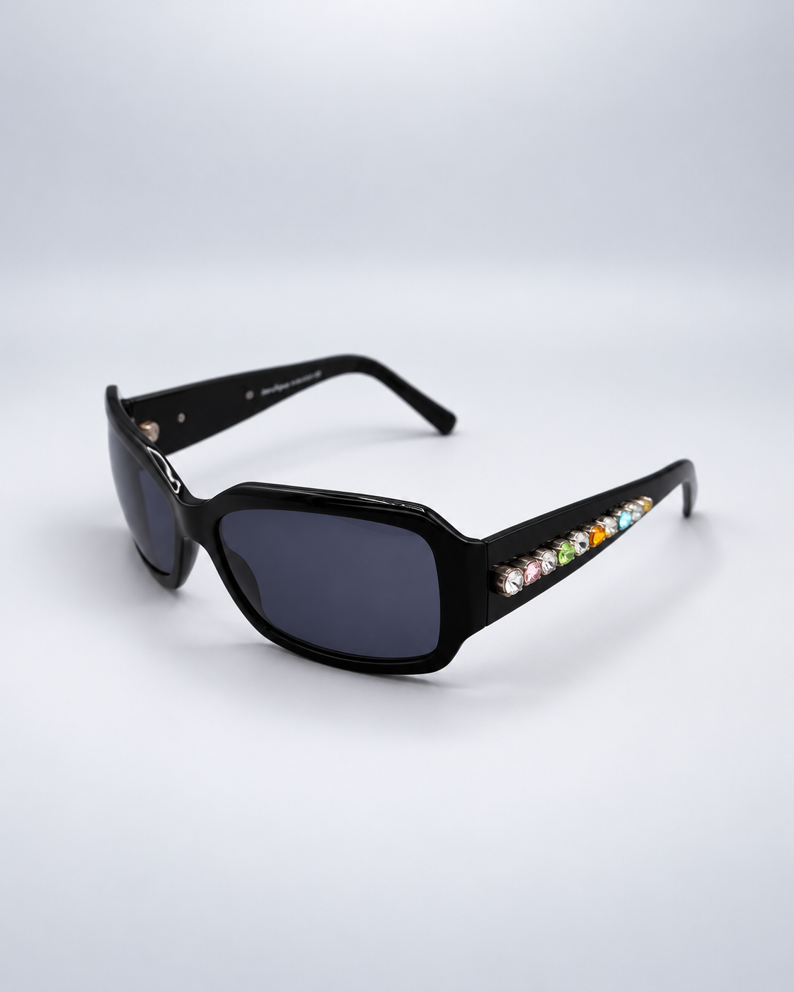 Sunglasses on a soft pale gray studio background
