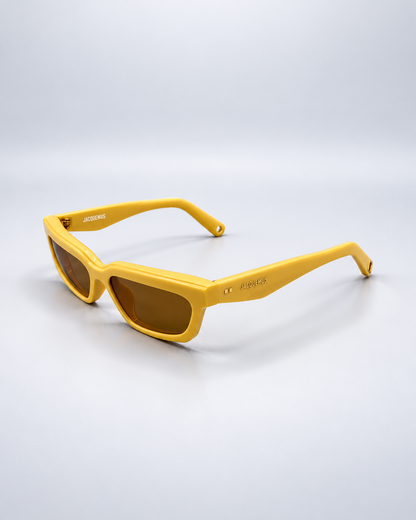 Jacquemus rectangular sunglasses photographed on a pale gray studio background