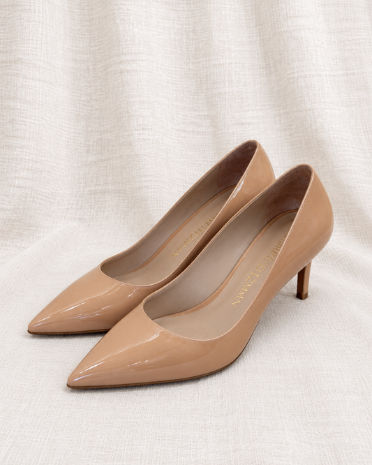STUART WEITZMAN, Nude Patent Pumps, 8 — left-facing pair on ivory linen