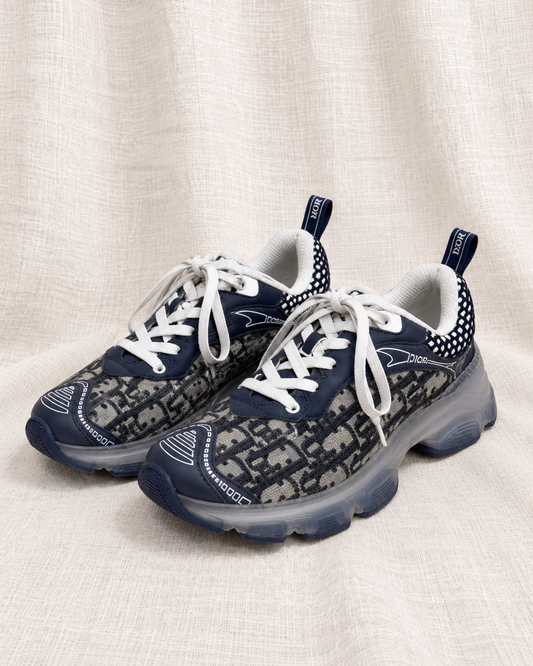 DIOR, Trainers, 37 — closely grouped left-facing pair on ivory linen
