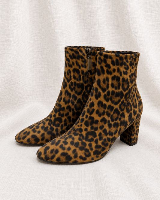SAINT LAURENT, Suede Leopard Print Ankle Boots, 37.5 — left-facing pair on ivory linen