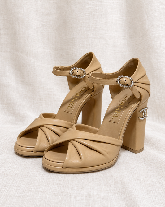 CHANEL, Pearl Double C Block Heel Sandals, 36 — left-facing pair on ivory linen