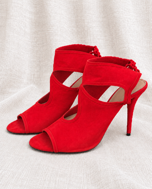 AQUAZZURA red suede heels — left-facing pair without tissue stuffing on ivory linen