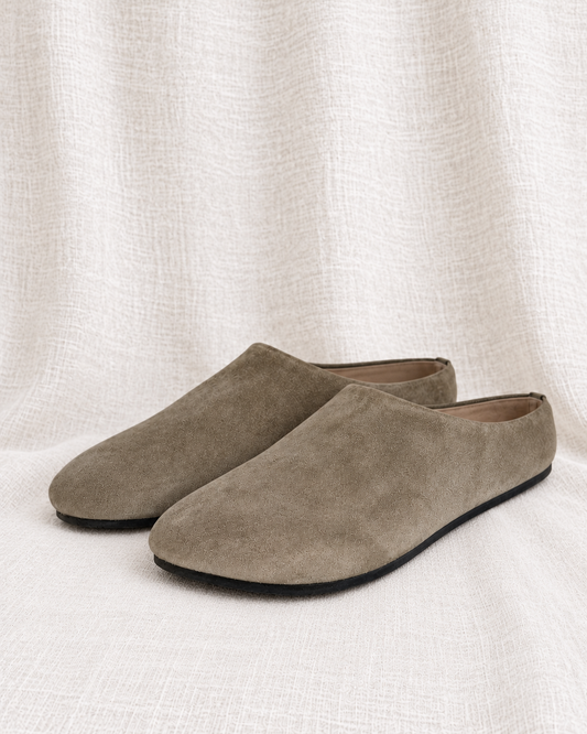 THE ROW, Suede Hudson Mules, 38 — left-facing pair on ivory linen