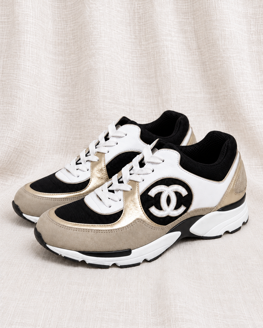 CHANEL, 2023 Logo Sneakers, 39.5 — left-facing pair on ivory linen