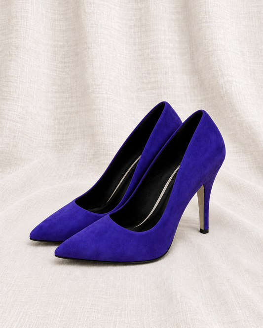 CALVIN KLEIN Purple Suede Pumps — closely grouped left-facing pair on ivory linen