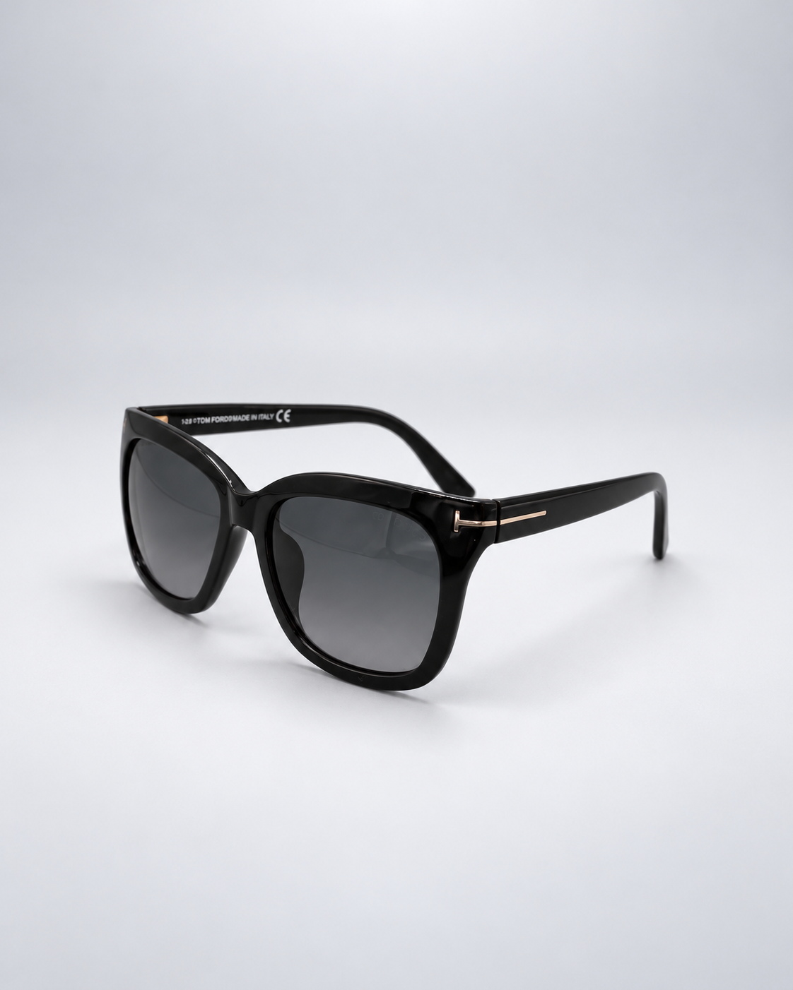 Sunglasses photographed against a soft light gray studio background