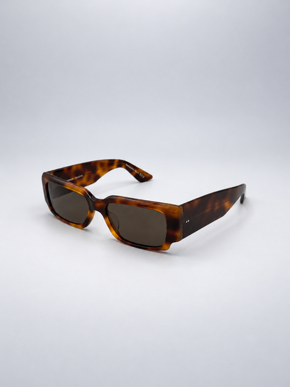Sunglasses photographed against a soft light gray studio background