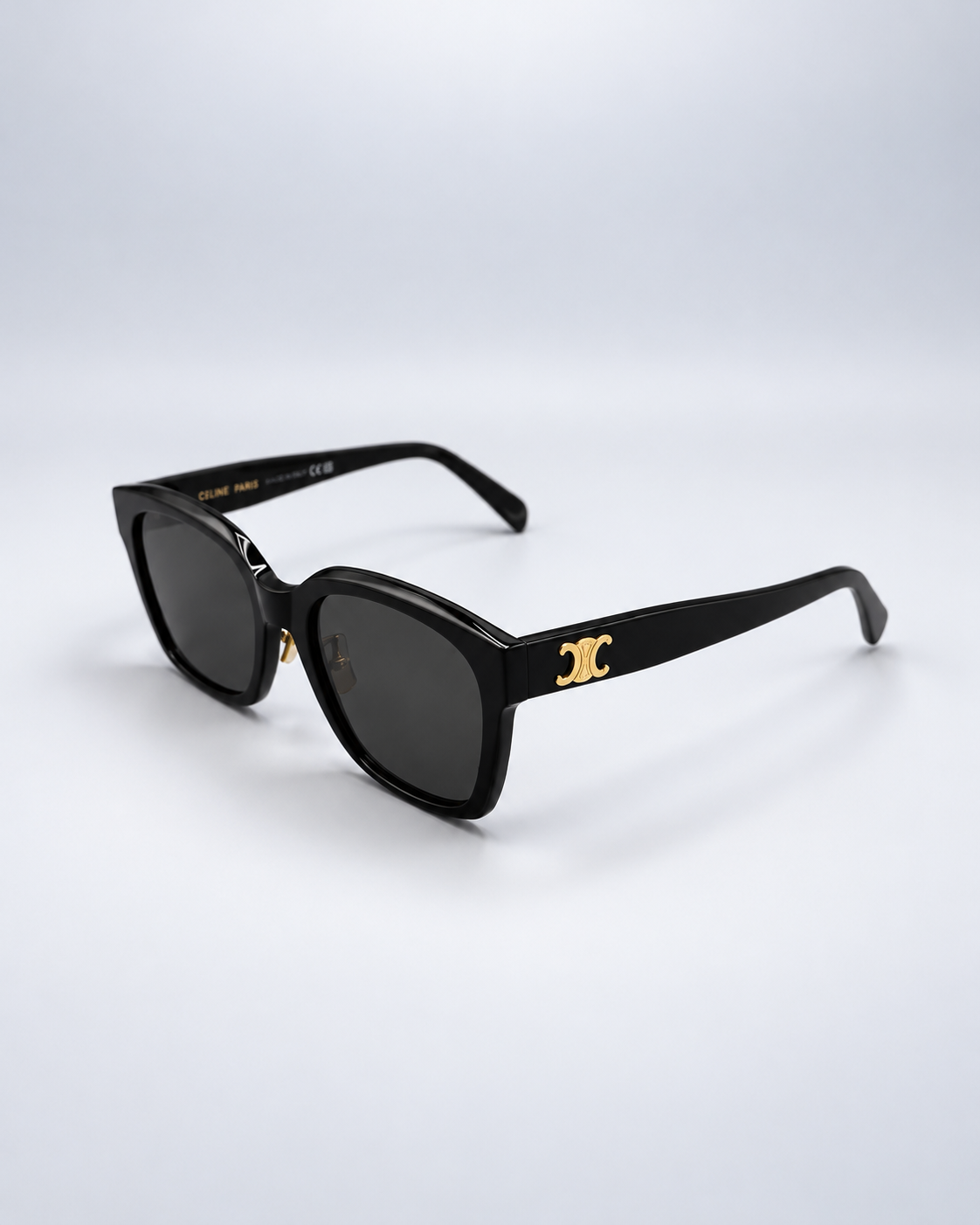 Sunglasses on a soft pale gray studio background