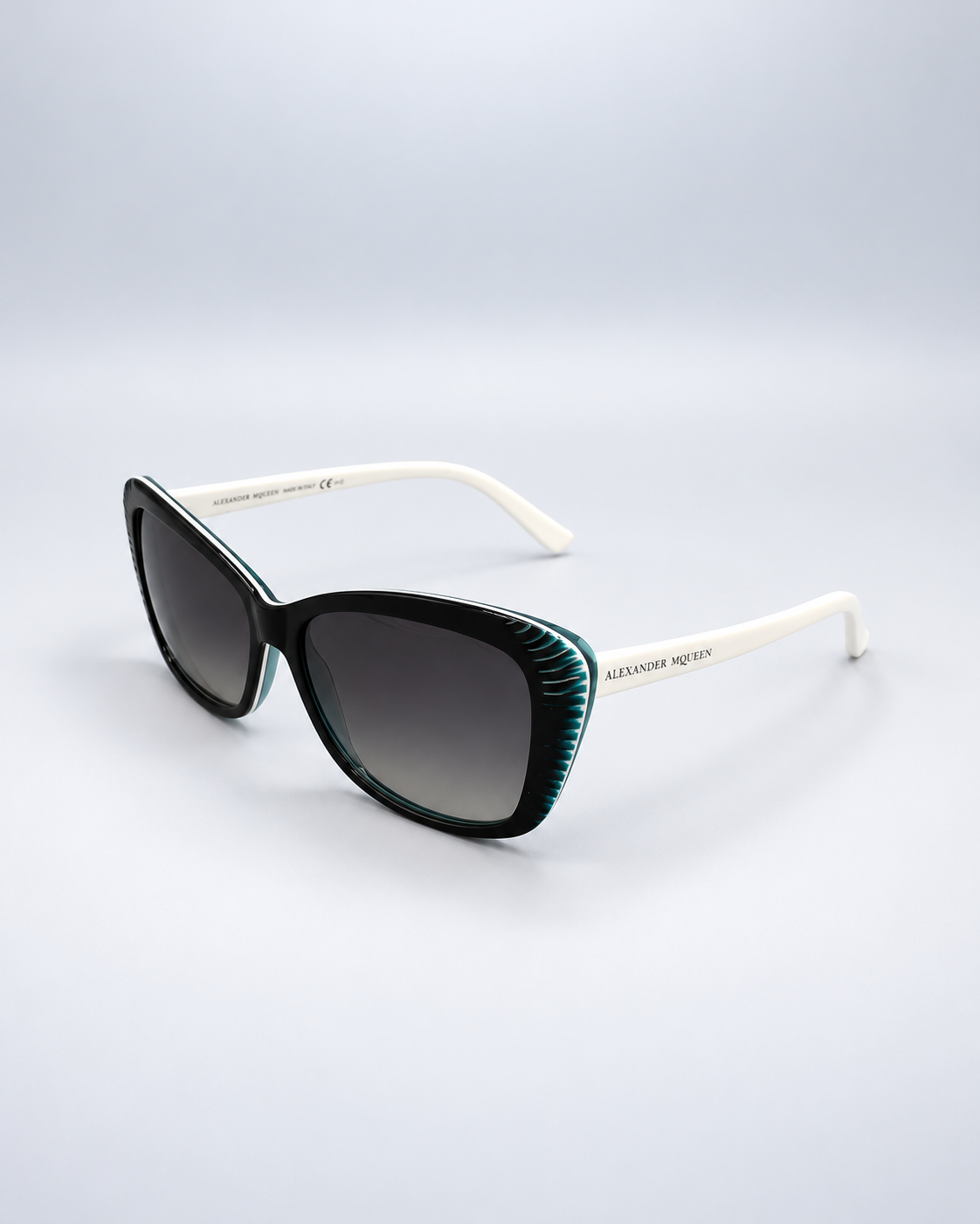 Sunglasses on a soft pale gray studio background