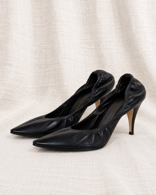 THE ROW Liisa pumps — close left-facing pair on ivory linen